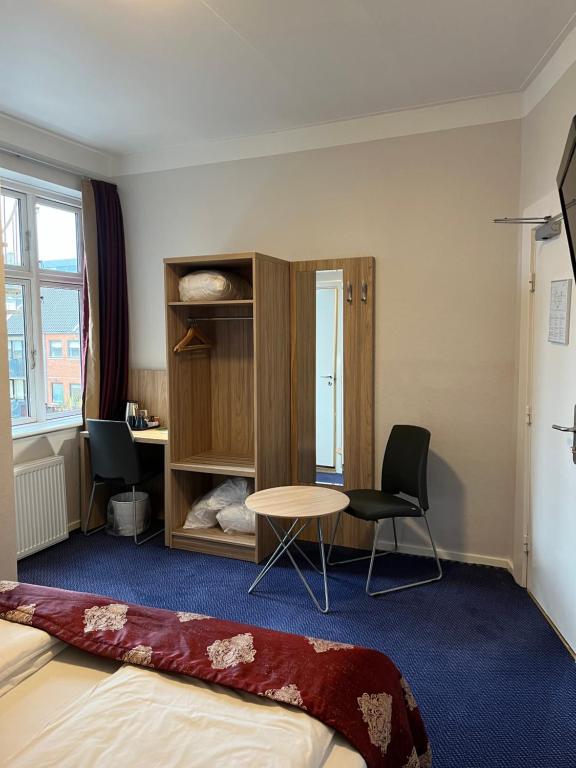 Postel nebo postele na pokoji v ubytování Hotel Skandia