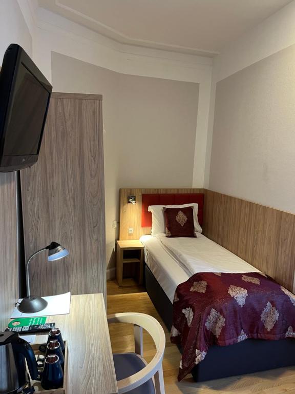 Postel nebo postele na pokoji v ubytování Hotel Skandia