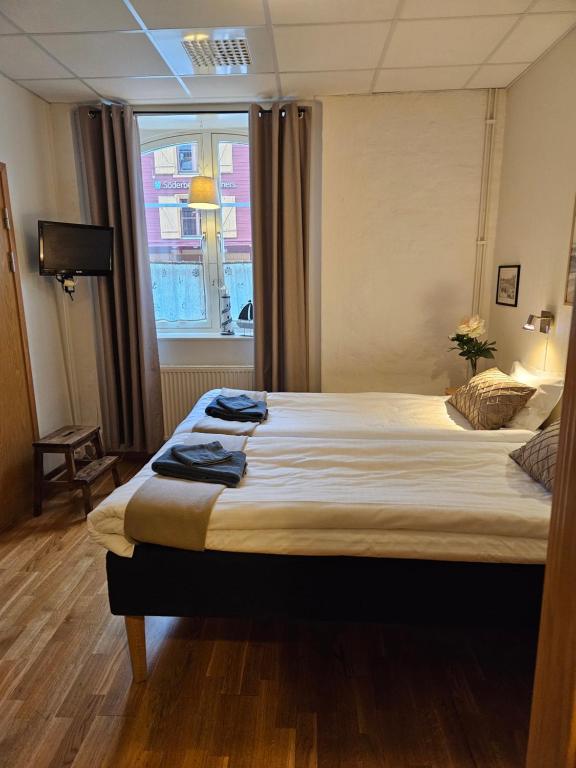 Postel nebo postele na pokoji v ubytování Hotell Alderholmen