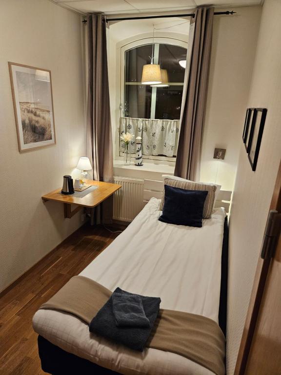 Postel nebo postele na pokoji v ubytování Hotell Alderholmen