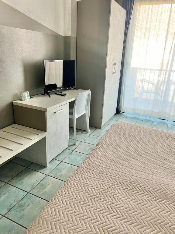 Postel nebo postele na pokoji v ubytování Hotel Stazione sul lago di Iseo