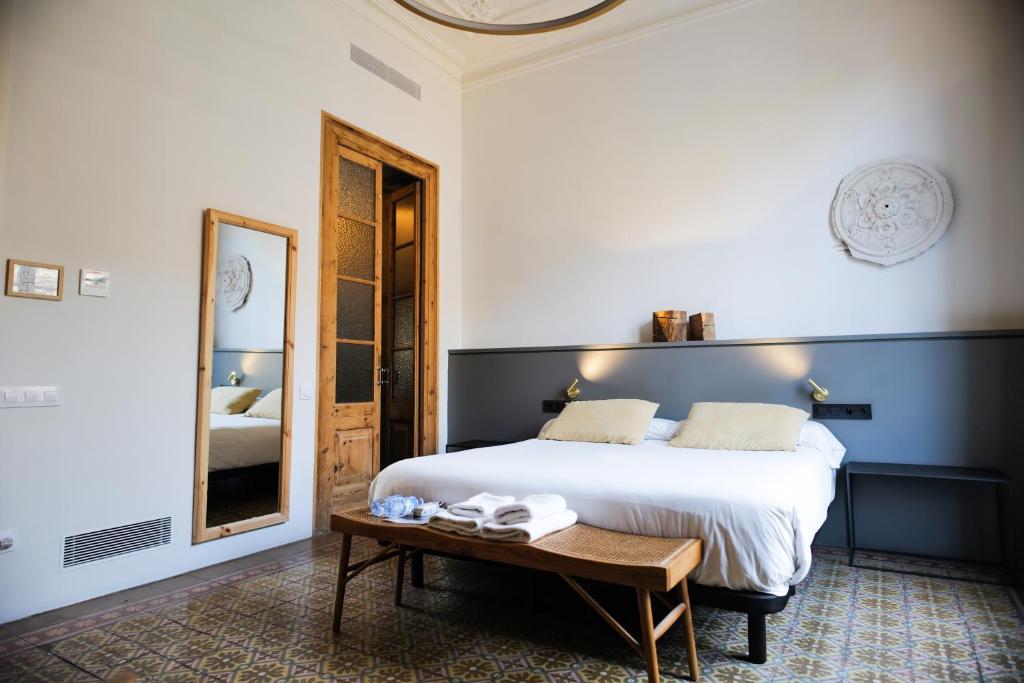 Postel nebo postele na pokoji v ubytování Hostal Porxos Garden