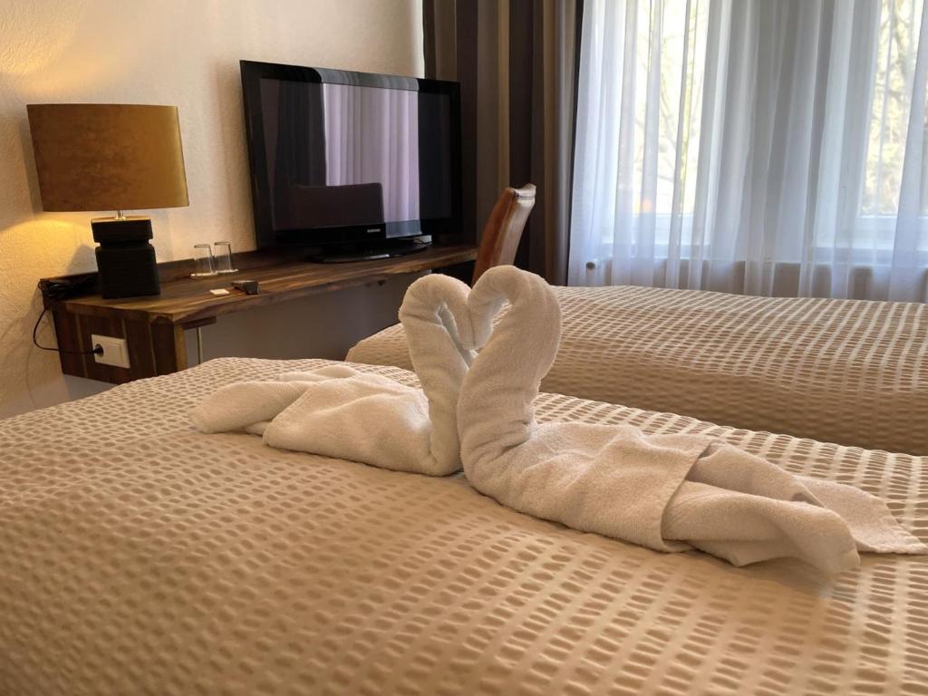 Postel nebo postele na pokoji v ubytování Hotel Antoni