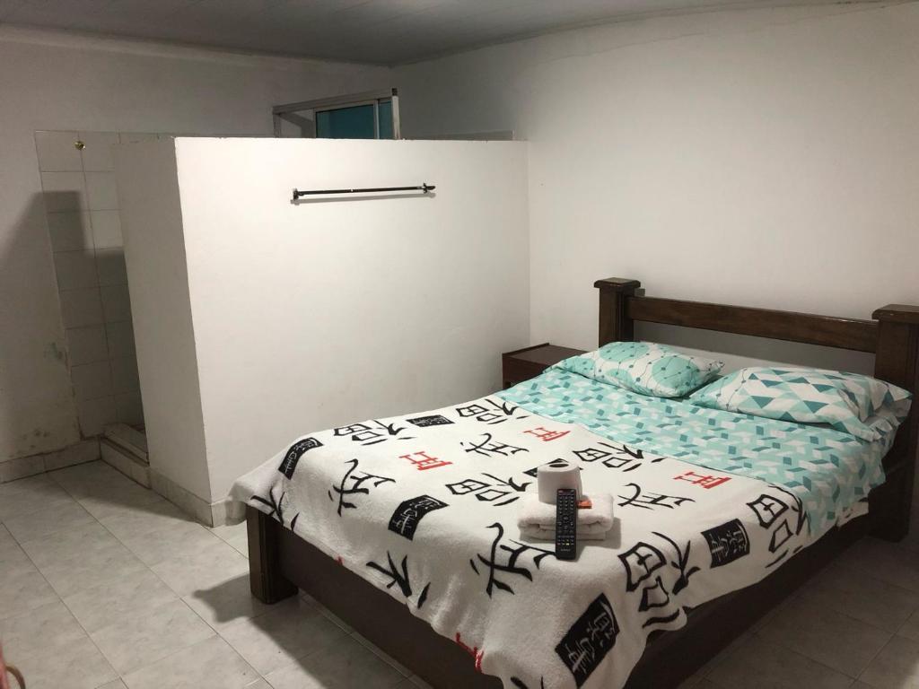 Postel nebo postele na pokoji v ubytování Hotel El Triangulo