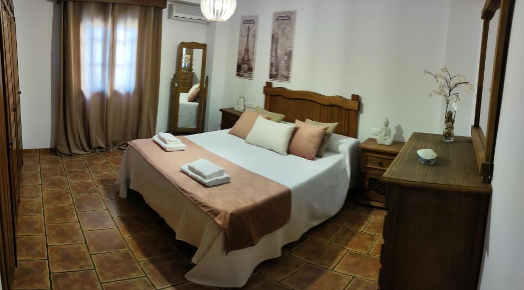 Postel nebo postele na pokoji v ubytování CASA LAURA