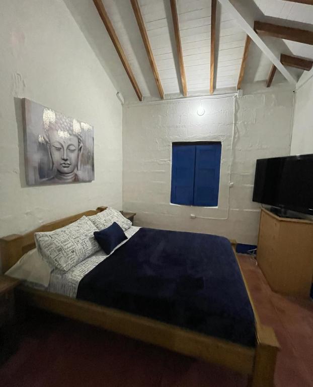 Postel nebo postele na pokoji v ubytování Hacienda San Francisco