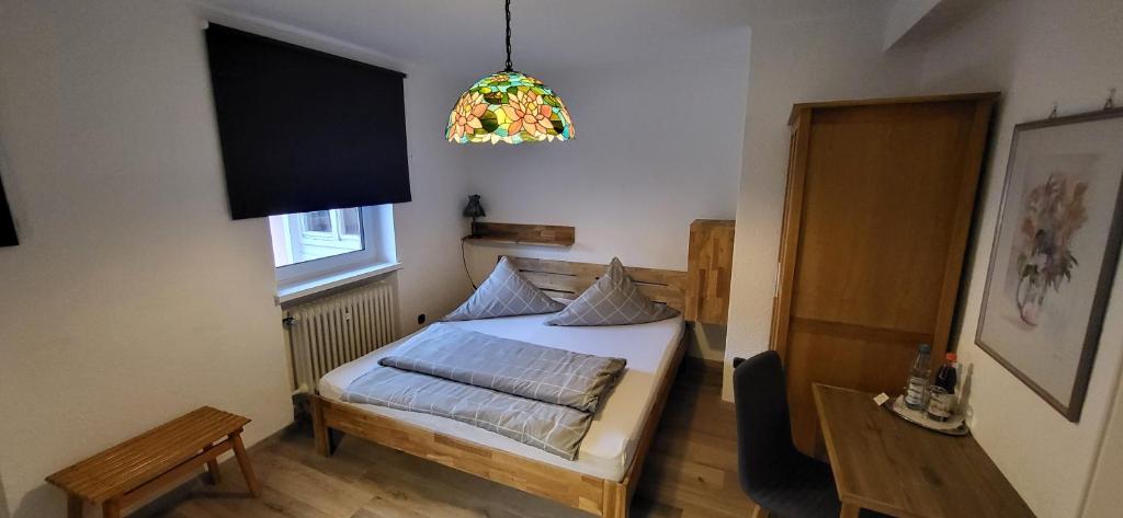 Postel nebo postele na pokoji v ubytování Hotel Zrenners GARNI