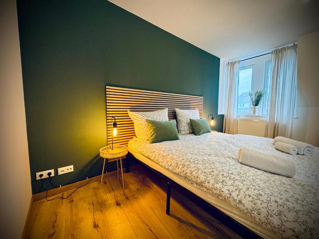 Ένα ή περισσότερα κρεβάτια σε δωμάτιο στο One Apartment's - Zentral - Steinweg