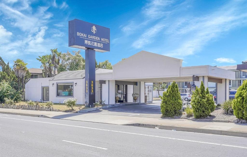 a sign for a hotel on the side of a street at Bokai Garden Hotel in Rosemead