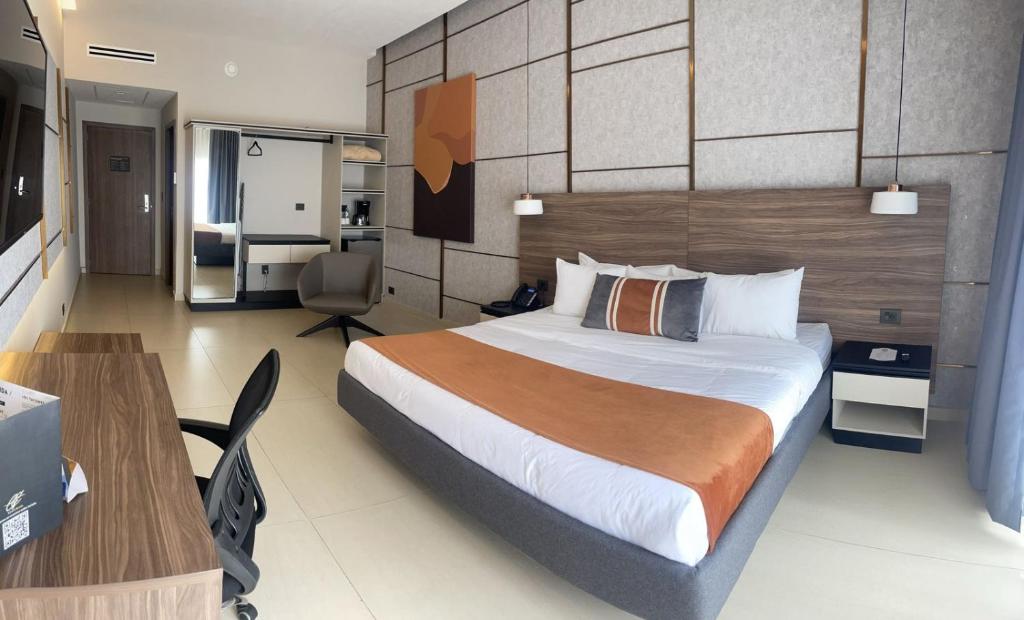 Postel nebo postele na pokoji v ubytování Grand Hotel&Casino Vía Dorada