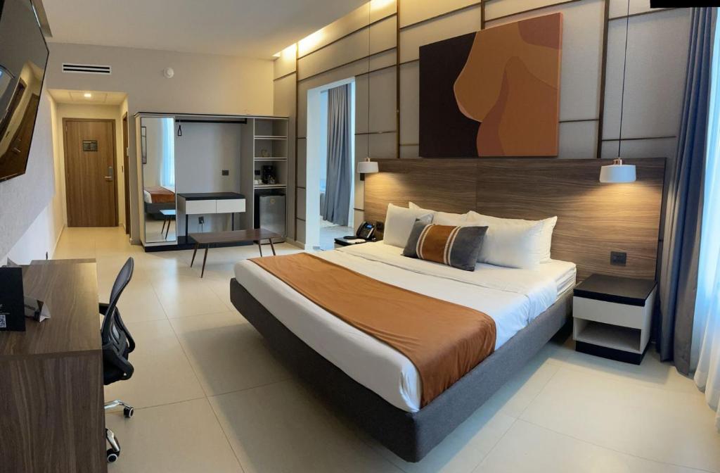 Postel nebo postele na pokoji v ubytování Grand Hotel&Casino Vía Dorada
