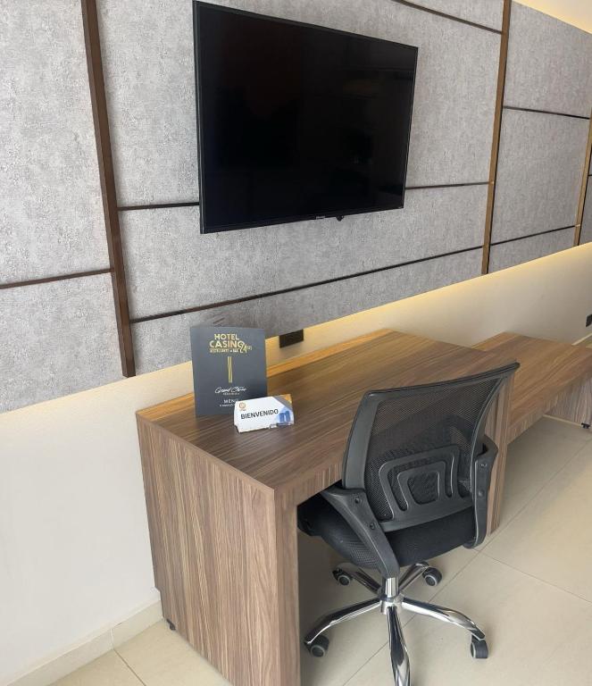 TV a/nebo společenská místnost v ubytování Grand Hotel&Casino Vía Dorada
