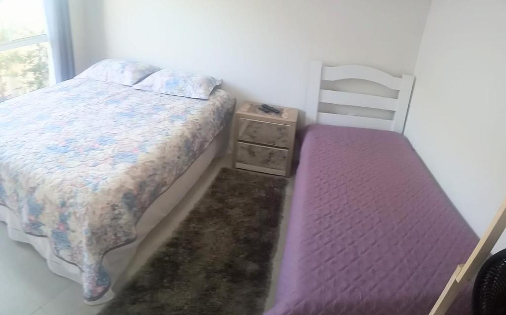 Posteľ alebo postele v izbe v ubytovaní Suíte Deluxe