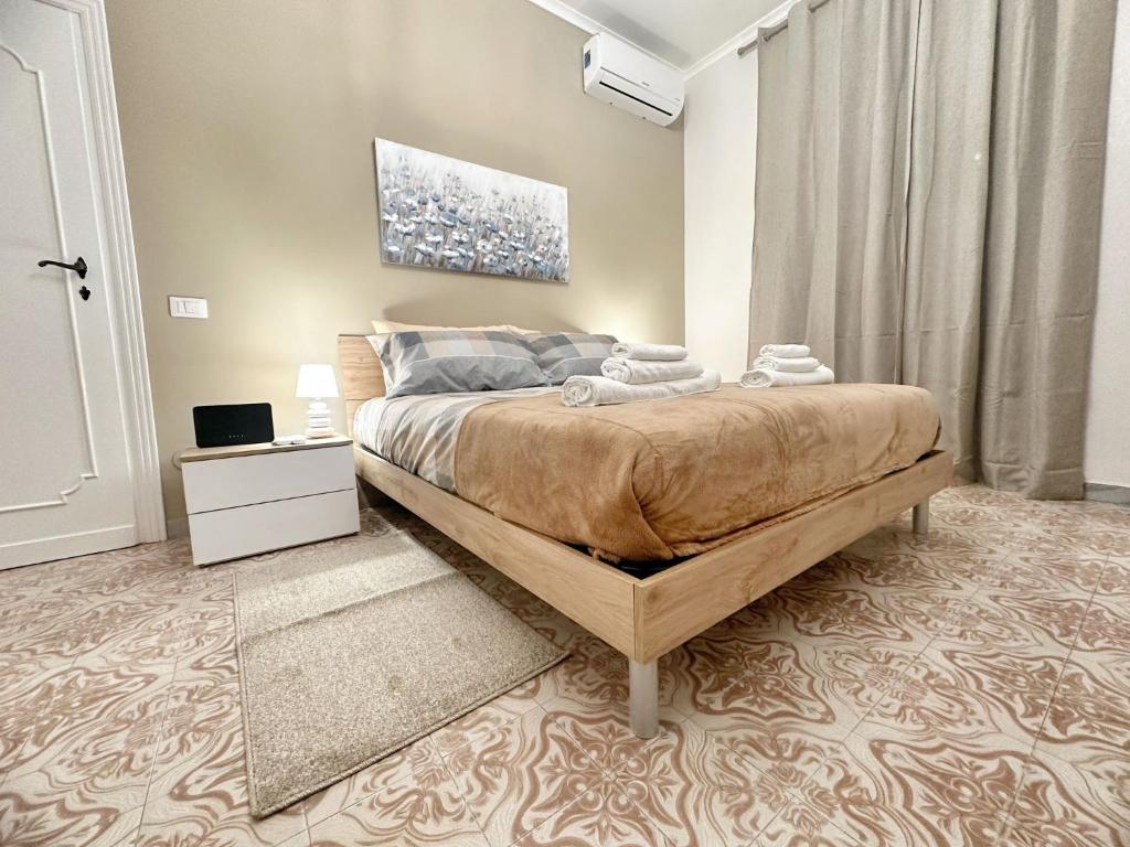a bedroom with a large bed in a room at Maison Grimaldi Roma in Rome