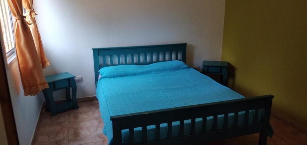 Ένα ή περισσότερα κρεβάτια σε δωμάτιο στο Deptos. Las Campanitas