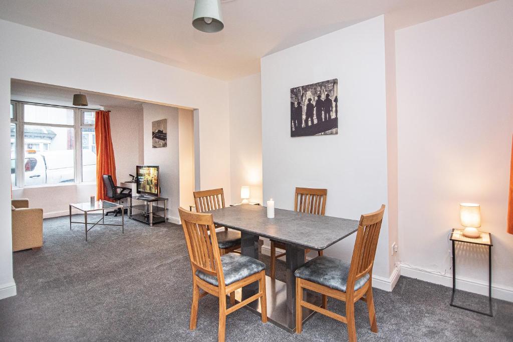 a dining room with a table and chairs at Captivating 3-Bed House in Doncaster in Doncaster