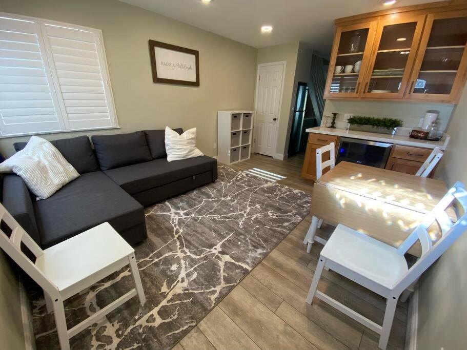 a living room with a couch and a table at Newly remodeled condo in Groveland