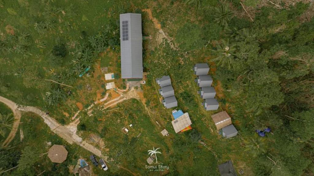 an aerial view of a building in the grass at SZ Samui Glamping in Ban Sa Ket