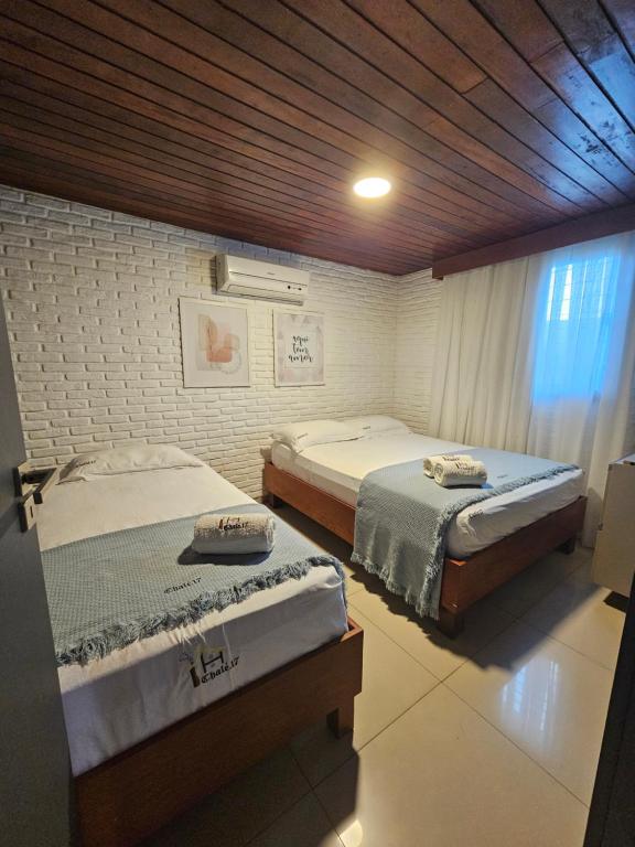 Postel nebo postele na pokoji v ubytování Charme do Chalé 17 em Gravatá