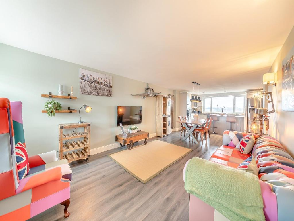 a living room with a couch and a table at Wynmine Cottage in Esh