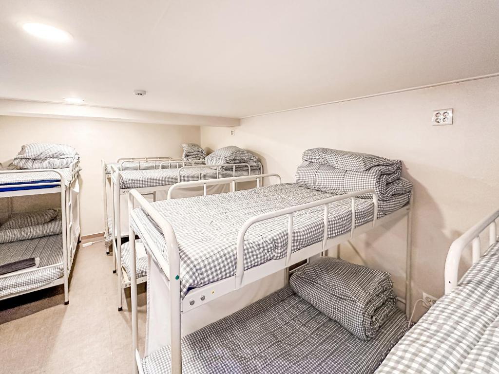 Postel nebo postele na pokoji v ubytování Dongseongro ZERO guesthouse