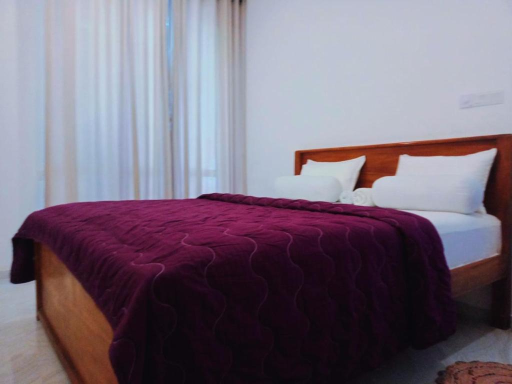 Postel nebo postele na pokoji v ubytování BLUE WHALES HOTEL