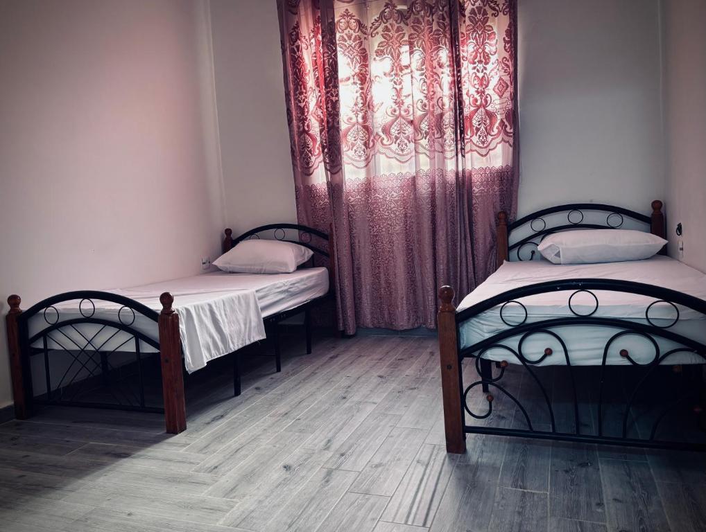 Ліжко або ліжка в номері Appartement Oran