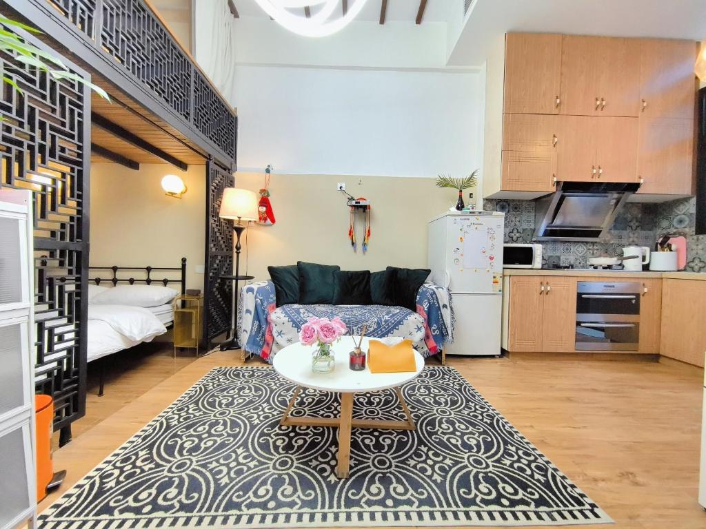 a living room with a couch and a table at Shanghai Hills & Zinn Happy Family Bnb in Shanghai