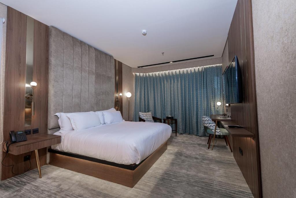 Postel nebo postele na pokoji v ubytování Damask Hotels