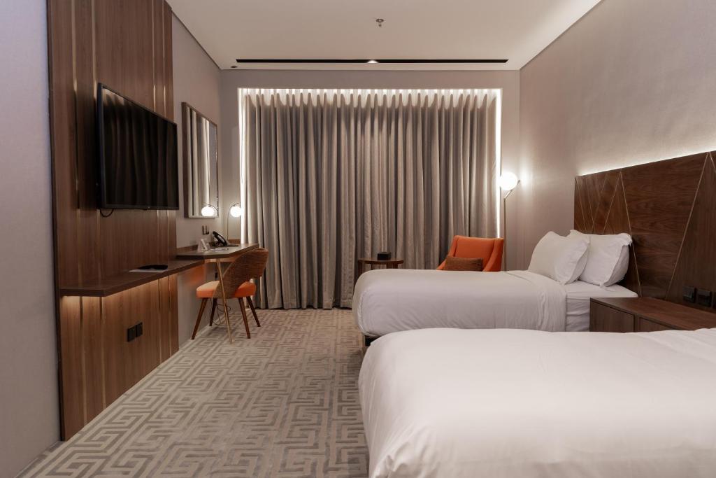 Postel nebo postele na pokoji v ubytování Damask Hotels