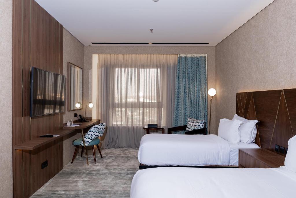 Postel nebo postele na pokoji v ubytování Damask Hotels