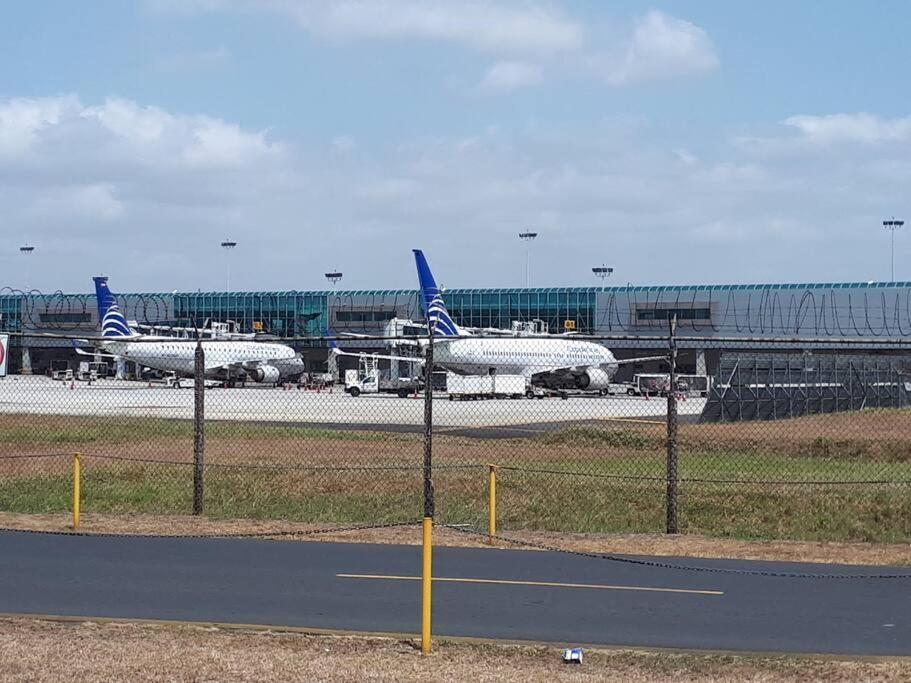 two planes are parked on the runway at an airport at The best place to rest near Tocumen Airport in Panama City