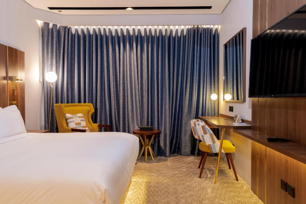 Postel nebo postele na pokoji v ubytování Damask Hotels