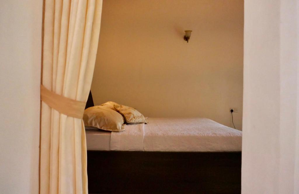 Postel nebo postele na pokoji v ubytování The Bliss Hostel Kandy