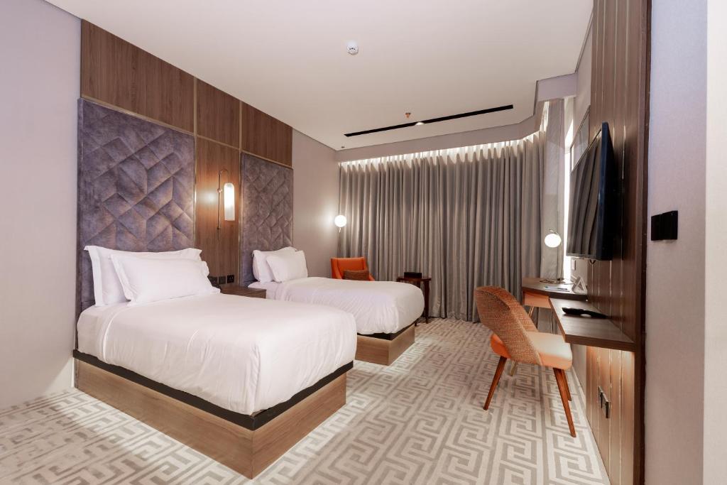 Postel nebo postele na pokoji v ubytování Damask Hotels