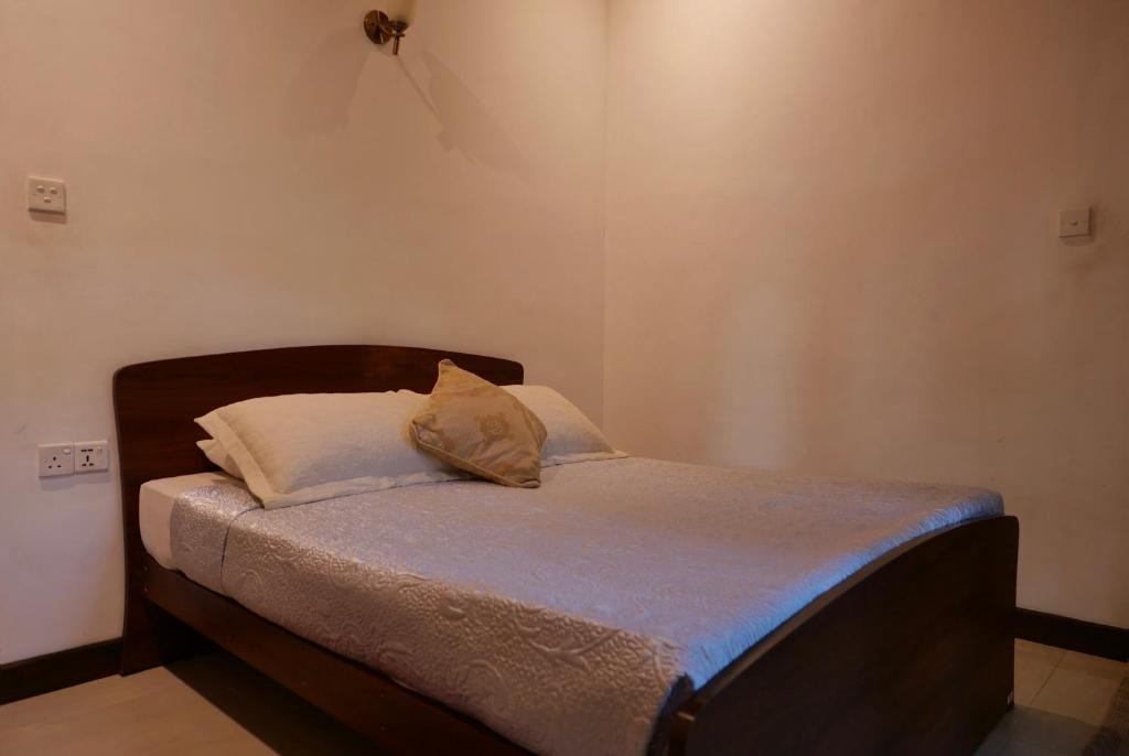 Postel nebo postele na pokoji v ubytování The Bliss Hostel Kandy