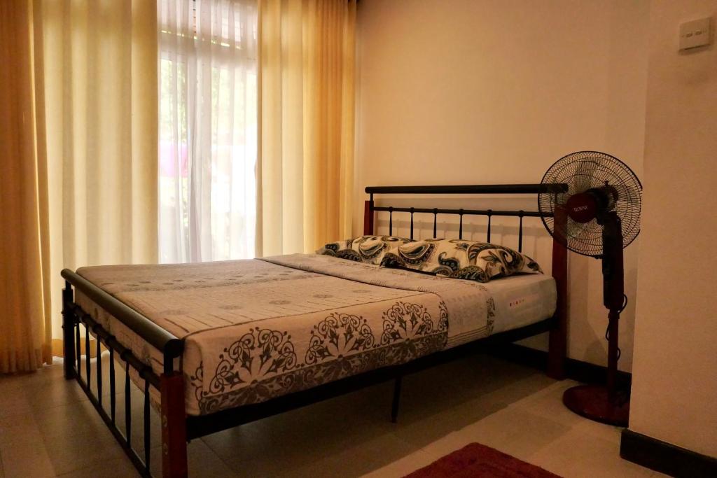 Postel nebo postele na pokoji v ubytování The Bliss Hostel Kandy