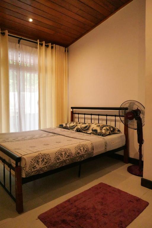 Postel nebo postele na pokoji v ubytování The Bliss Hostel Kandy