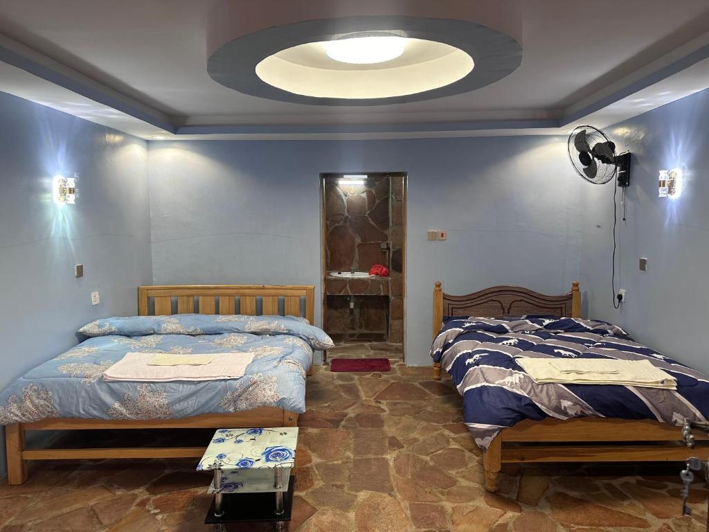 Postel nebo postele na pokoji v ubytování Luluka Guest House