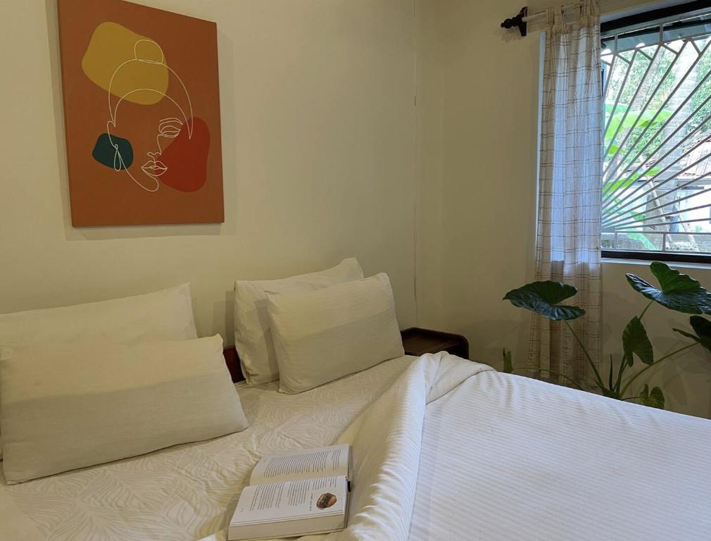 Postel nebo postele na pokoji v ubytování Tien B&B & Bistro