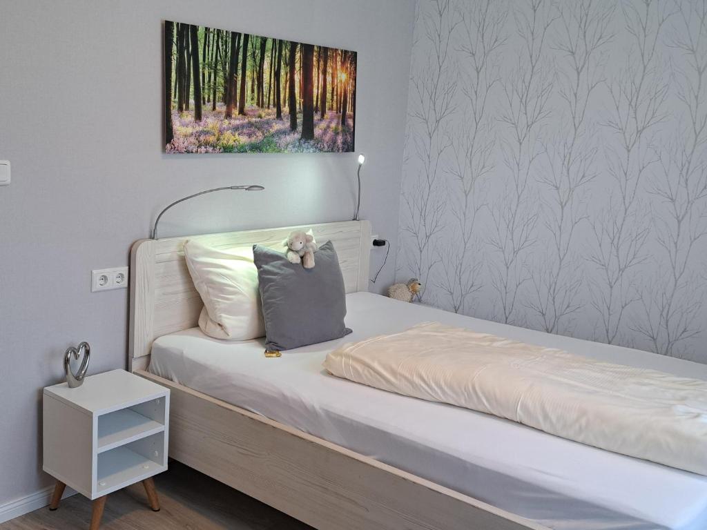 Postel nebo postele na pokoji v ubytování Dat lütte Heidehotel Funk - Garni