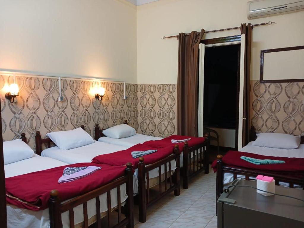 Postel nebo postele na pokoji v ubytování New Palace Hotel