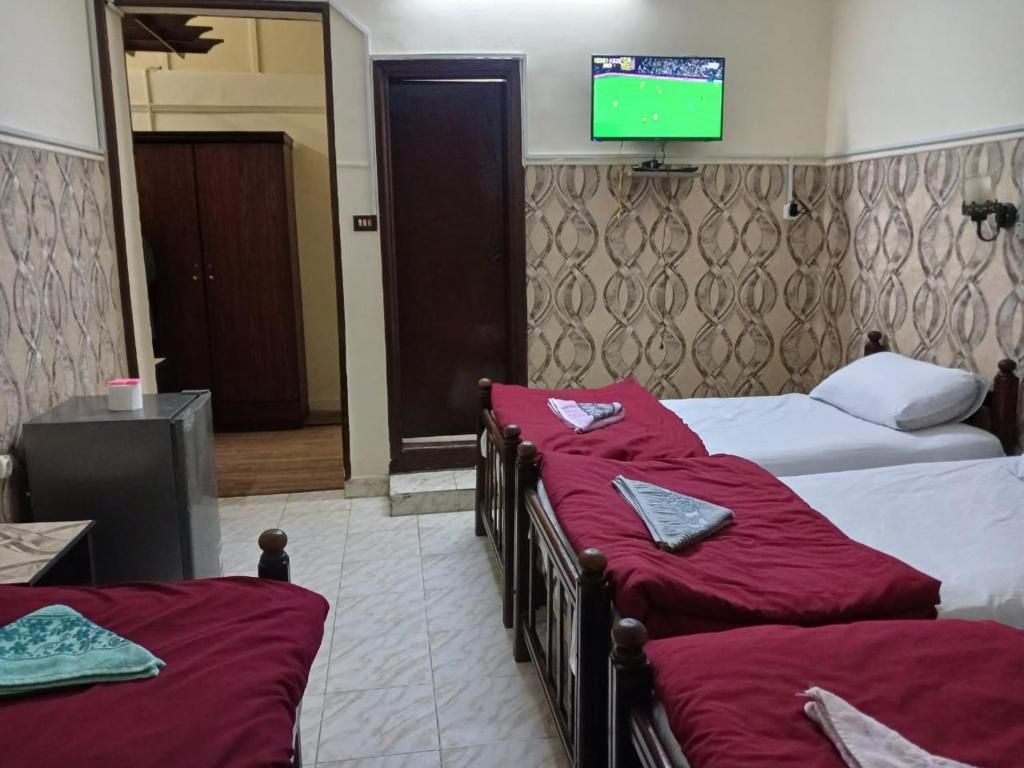 Postel nebo postele na pokoji v ubytování New Palace Hotel