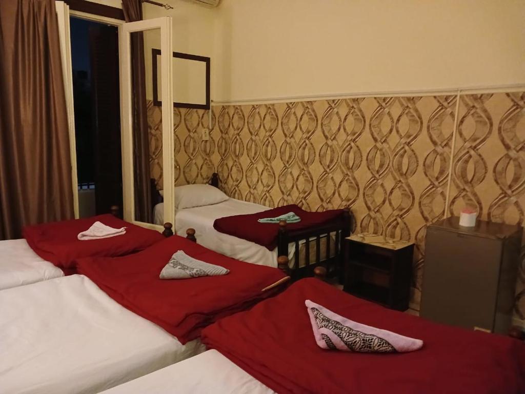 Postel nebo postele na pokoji v ubytování New Palace Hotel