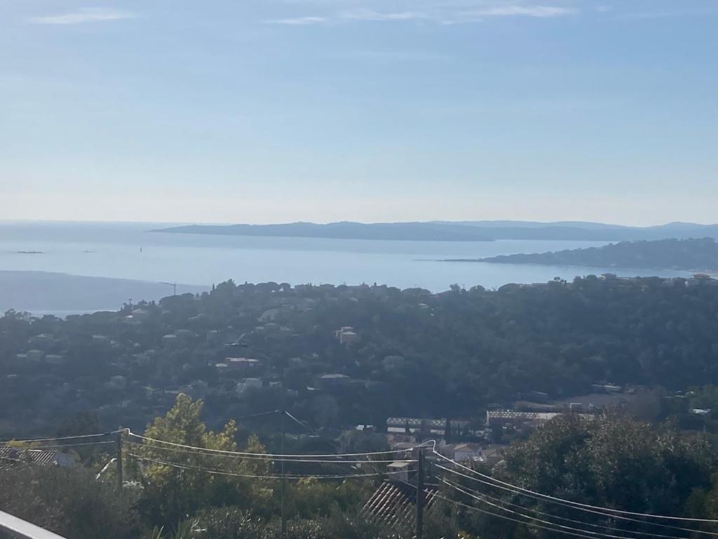 a view of a body of water from a hill at Cœur d’arty show in La Garonnette-Plage