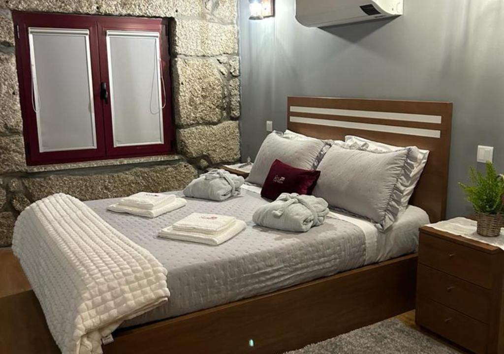 Cama ou camas em um quarto em Quinta das Carvoeiras