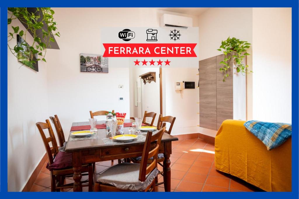 a dining room with a table and chairs at Ferrara center - Luxury apartment in medieval area with Wi-Fi in Ferrara