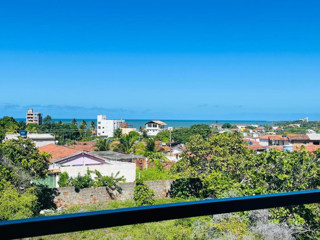 a view of a city from a balcony at Chalés Jacumã Paradise in Jacumã