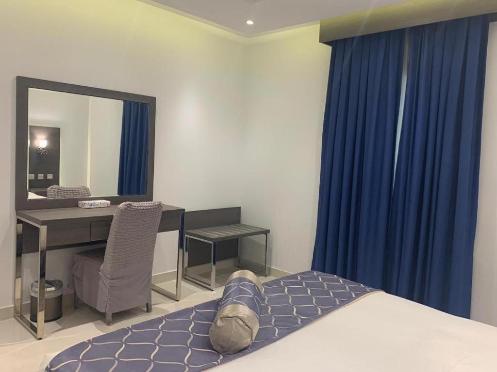 Postel nebo postele na pokoji v ubytování عماره هوليداي المروة- Holiday Al Marwa Building