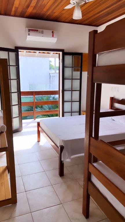 Postel nebo postele na pokoji v ubytování Pousada Ubatuba Itaguá